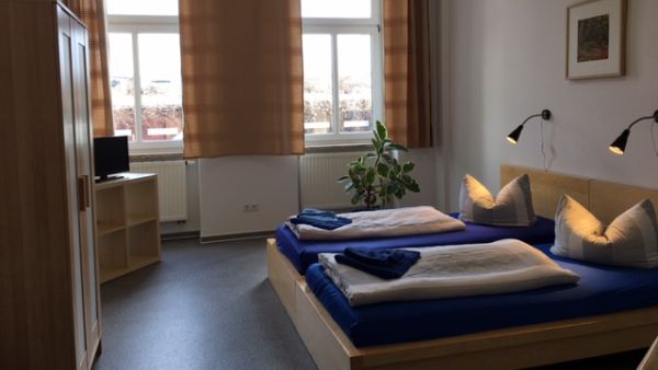 A bed Privatzimmer - Apartment-Ansicht 1